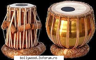 Muzica Indiana - instrumente --->>>Sitar cel de mai sus si Tabla - Breaking News